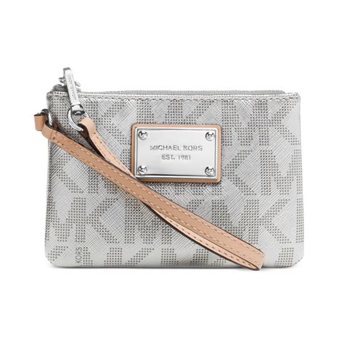 michael kors purse with silve chair|Michael Kors small wristlet.